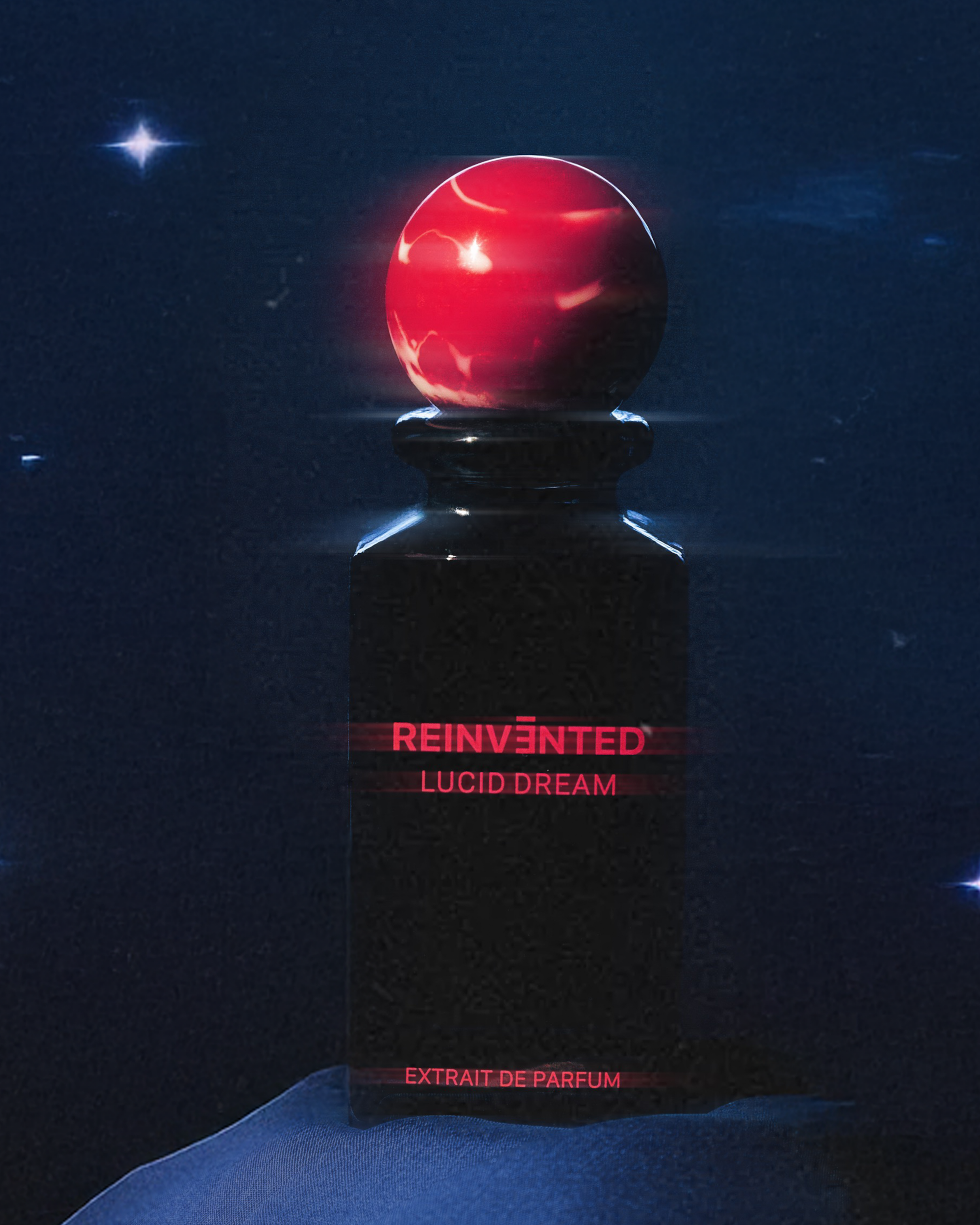 Image of Perfume bottle labeled 'Reinvented Lucid Dream' with a red cap on a dark background