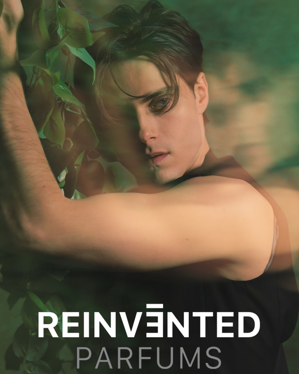 Person with a blurred background and 'Reinvented Parfums' text